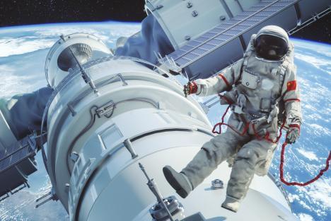 a man in an astronaut 's suit is floating in space