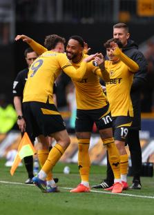Wolverhampton Wanderers players celebrating a goal.