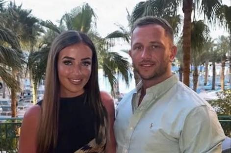 A British father-of-three has died after being allegedly being hit with a vodka bottle on a stag do in Prague David 'Dai' Richards, 31, was killed in the Czech capital when he was struck to the back on the head by the bottle on the first night of the stag weekend. The keen footballer from set off from his family home in Mountain Ash, South Wales, at 5am on Friday for the fun weekend away - but was attacked at 10pm in the street. He was put on a life support machine but died in hospital. Pictured here with his partner Jola Simms WALES NEWS SERVICE