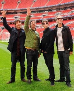 Oasis band members at Wembley Stadium.