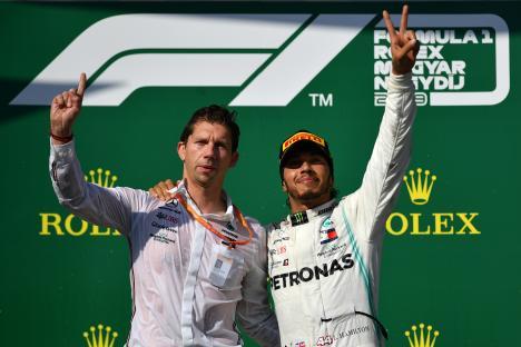 Lewis Hamilton celebrating on the Formula 1 podium.
