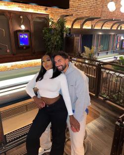 Whitney and Lochan holding hands.