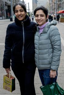 Two women standing together in Wembley, North West London.