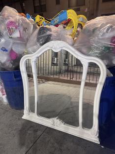 White ornate mirror found in the trash.