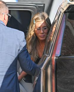 Jennifer Aniston getting into a car.
