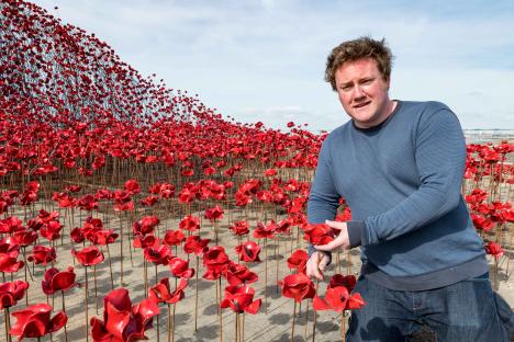 Artist Paul Cummins with his ceramic poppy sculpture,