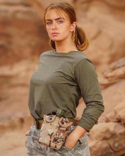 Maisie Smith in camouflage clothing.