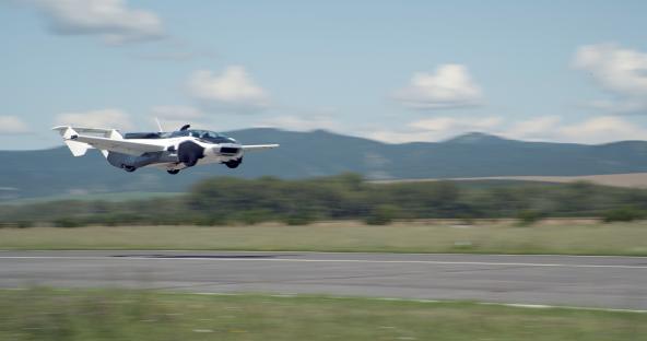 AirCar taking off from a runway.