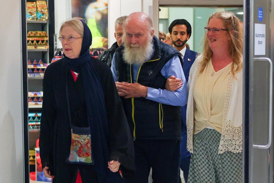 British couple Peter and Barbie Reynolds, released from Taliban detention, with their daughter Sarah Entwistle at Heathrow Airport.