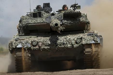 Leopard 2A6 tank moving during military exercise.