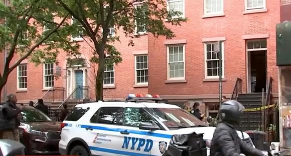 NYPD vehicle outside a building where a man was allegedly kidnapped and tortured.