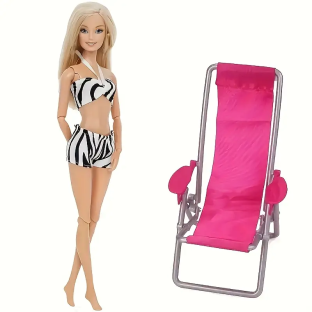 Barbie doll in zebra-print swimsuit with pink beach chair.