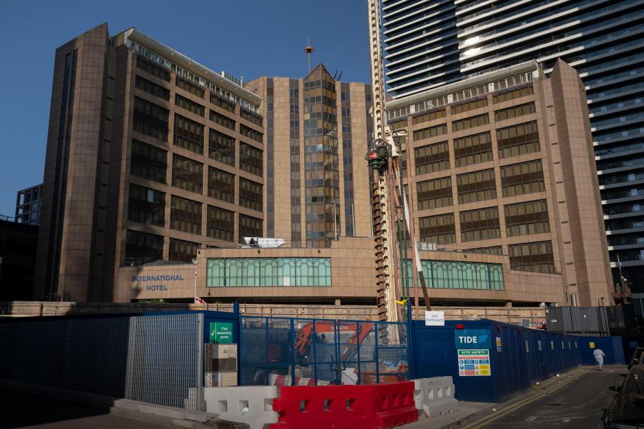 Britannia International Hotel in Canary Wharf, housing asylum seekers, with ongoing anti-migrant protests.