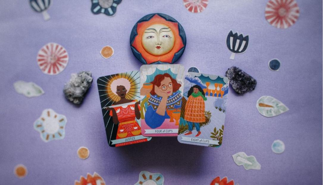 Three tarot cards: Justice, Four of Cups, and Eight of Cups, arranged with a sun carving and decorative elements.