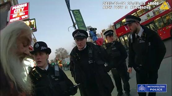 Police officers arresting a sex offender.