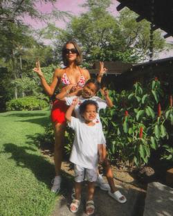 Khloe Kardashian in a bikini with her two children.