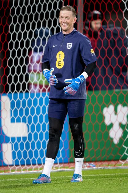 Jordan Pickford smiles during a warm-up for a FIFA World Cup 2026 qualifier match.