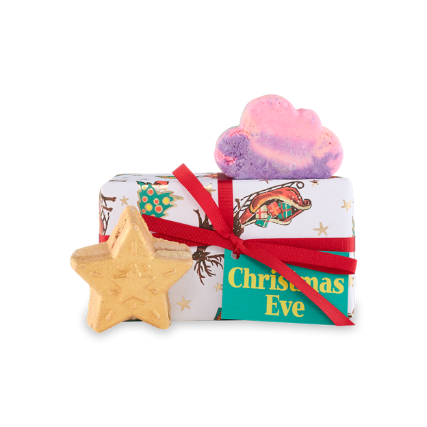 Christmas Eve gift set with bath bombs, including a cloud and a star shape, tied with a red ribbon.