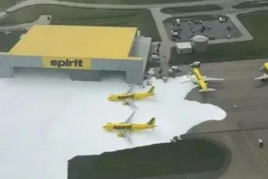Passenger planes left buried in FOAM in hanger with suds spilling over runway after giant fire extinguishers go wrong