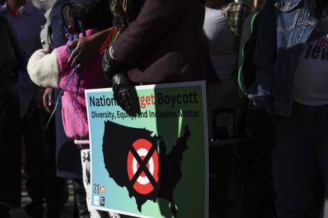 Person holding a sign calling for a national boycott of Target.