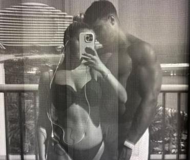 Black and white photo of Molly Mae Hague and Tommy Fury taking a selfie.