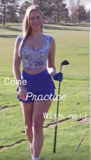 Paige Spiranac on a golf course, holding a golf club.