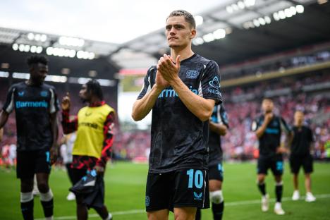 Florian Wirtz of Leverkusen applauding after a Bundesliga match.
