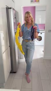 Woman demonstrating a DIY dusting tool.