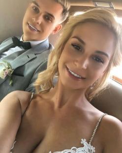 Bride and groom in a car.