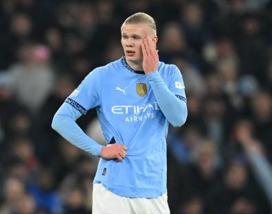 Erling Haaland of Manchester City looking dejected during a soccer match.