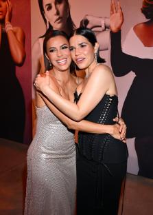 Eva Longoria and America Ferrera embracing at the ELLE Women in Hollywood event.
