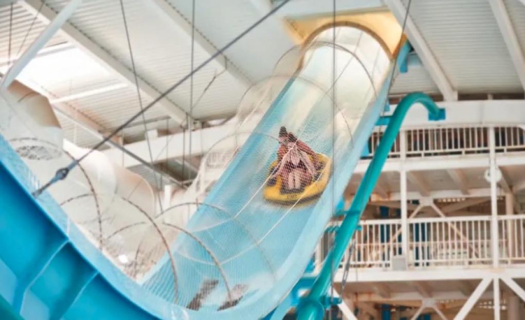 Person going down a water slide.