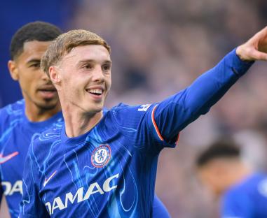 Cole Palmer celebrates scoring a penalty for Chelsea.