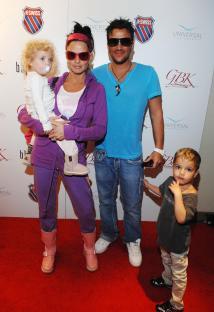 Katie Price, Peter Andre, and their children at an event.