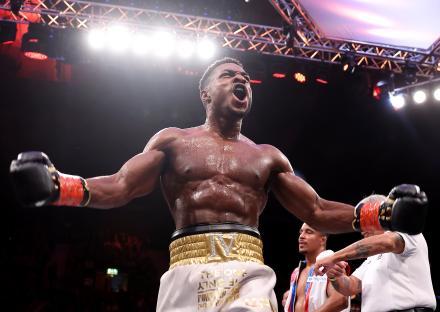 Idris Virgo celebrates winning a cruiserweight boxing match.