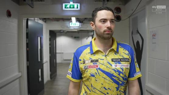 Taylor Maxwell in a yellow and blue darts shirt.