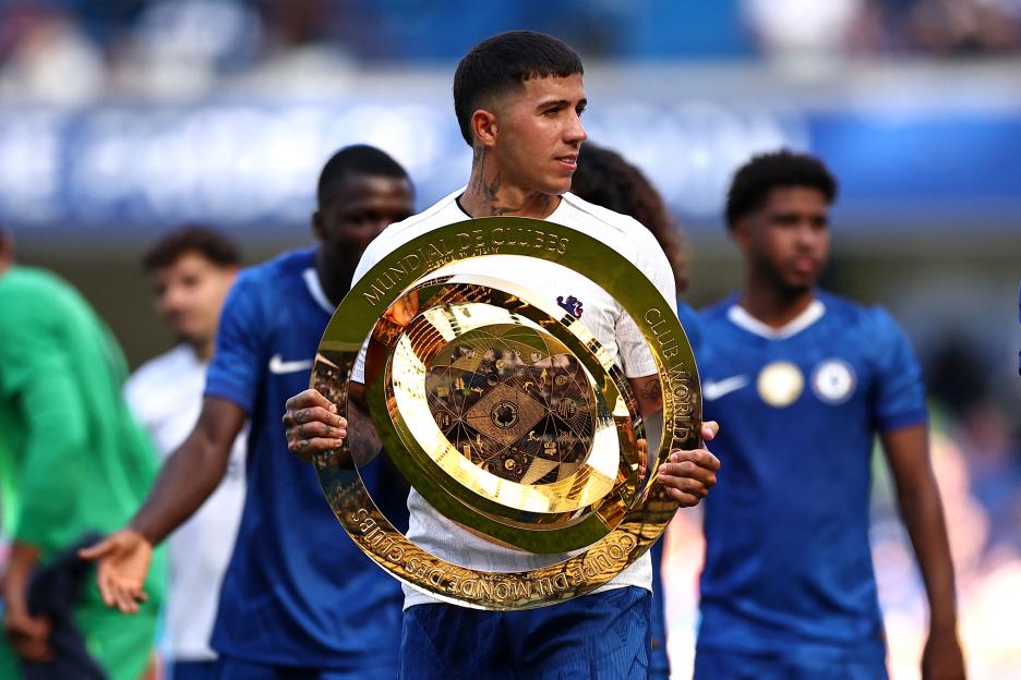 Enzo Fernandez holding the Club World Cup trophy.