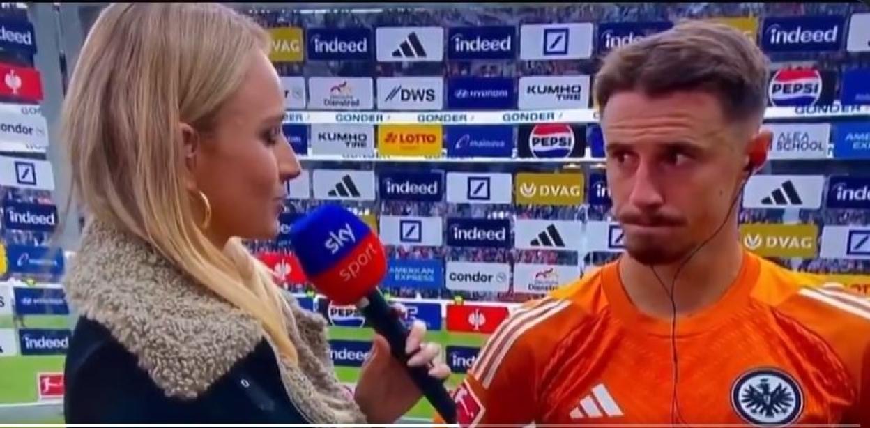 Sky Sports reporter interviewing a somber soccer player after a 4-1 loss.