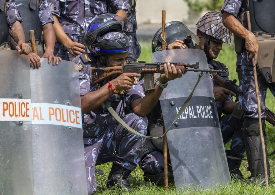 Police taking position as clashes erupt with protesters in Kathmandu, Nepal.