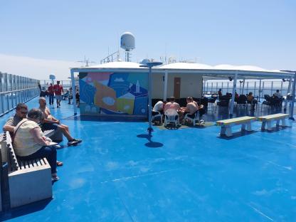 Passengers relaxing on the deck of a ferry from Portsmouth to Bilbao.