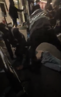 A bouncer being punched during a bar brawl.