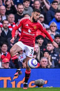 Noussair Mazraoui of Manchester United playing soccer.