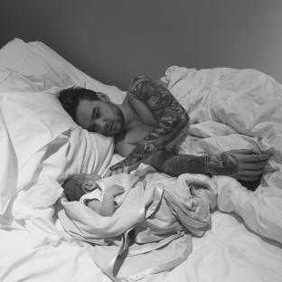 Liam Payne and his son Bear in bed.