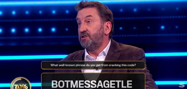 Man on game show trying to solve a code.