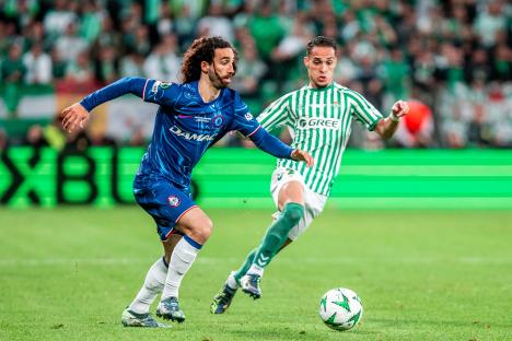Real Betis' Antony tackling Chelsea's Marc Cucurella during a soccer match.
