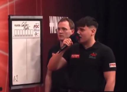 Darts players Andrew Gilding and Callan Rydz during a match.
