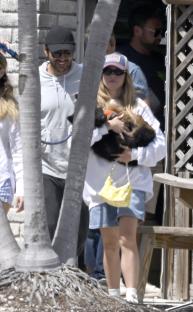 Sydney Sweeney and Jonathan Davino with a puppy.