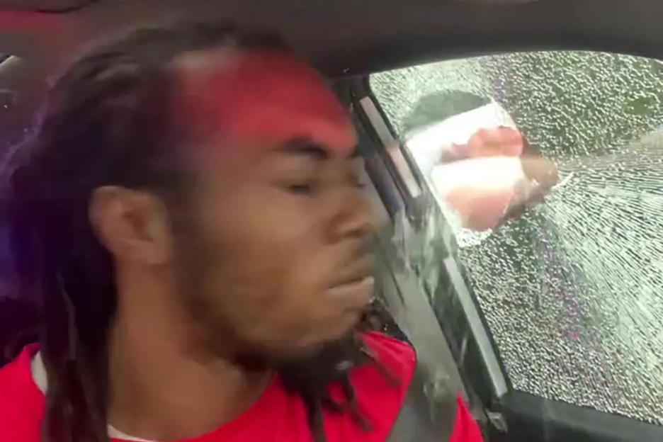 Shock moment cop smashes man’s car window and punches him in the head after stopping him for ‘not having headlights on’