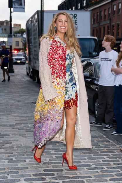 Blake Lively in the Meatpacking District wearing a multicolored beaded dress and coat.