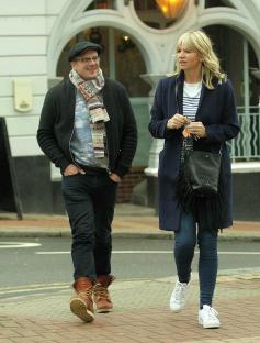 Zoe Ball and Billy Yates walking down the street.